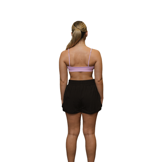 Woman black running shorts rear view 