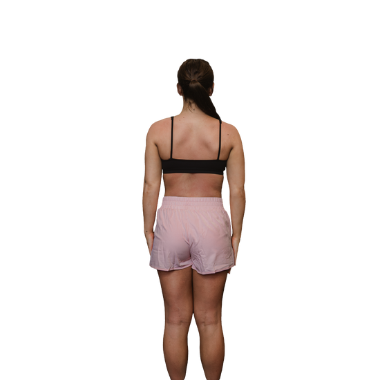 Woman pink running shorts rear view