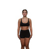 Woman wearing a black sports bra front view