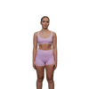 Woman wearing a pink sports bra front view