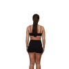 Woman wearing a black sports bra rear view 