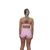 Woman wearing a pink sports bra rear view