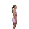Woman wearing a pink sports bra side view 