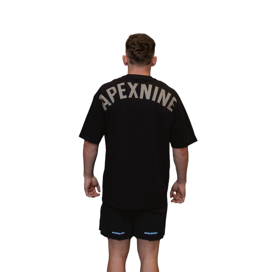 Man wearing relaxed tee unisex black rear view signature APEXNINE